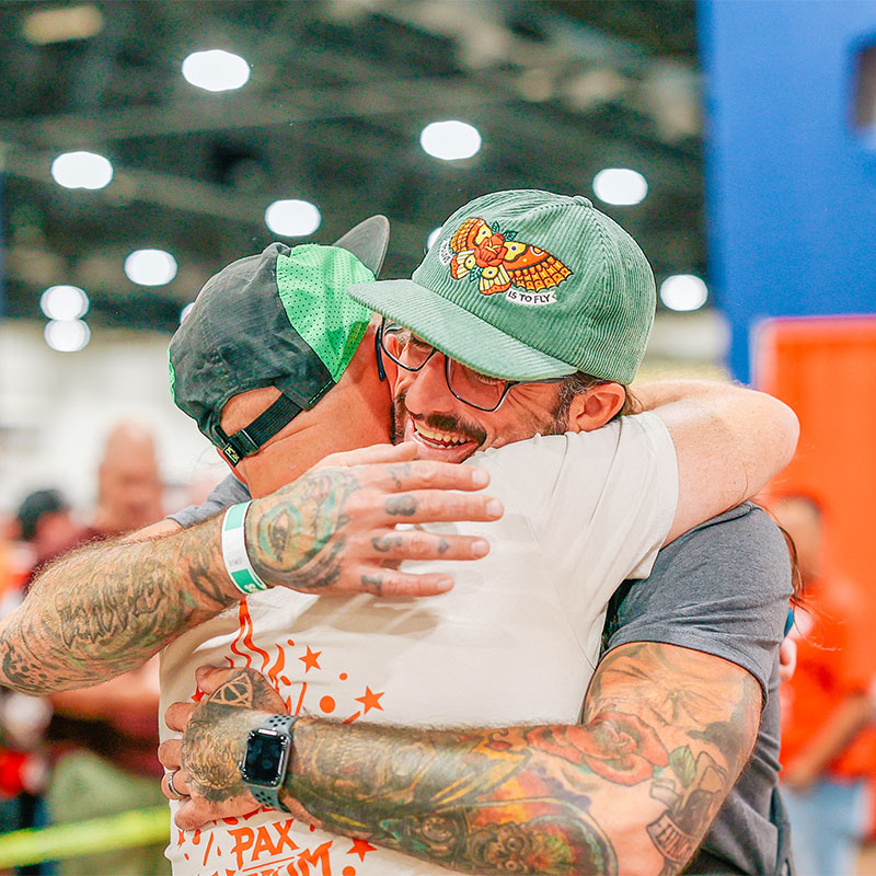 Two men hugging