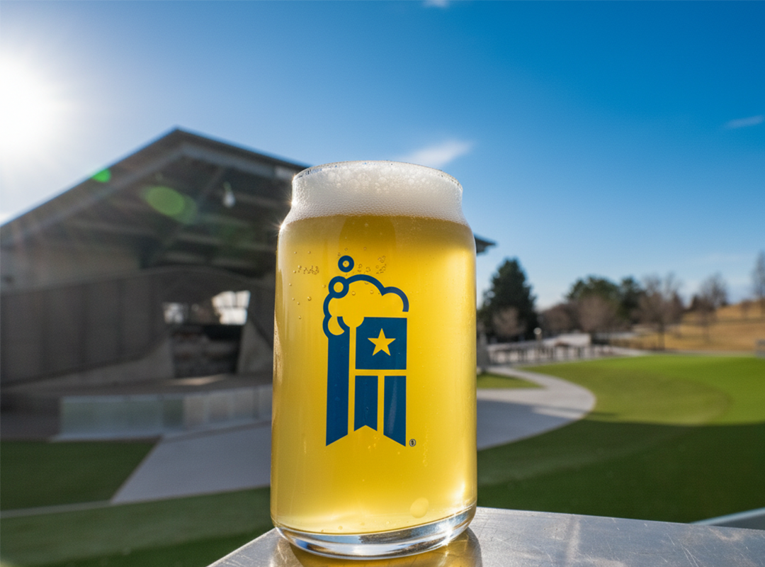 A GABF branded glass of beer in front of Levitt Pavilion